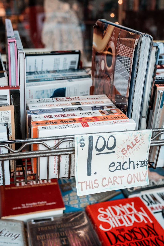 A cart filled with used books sold for  each, perfect for bargain hunters.